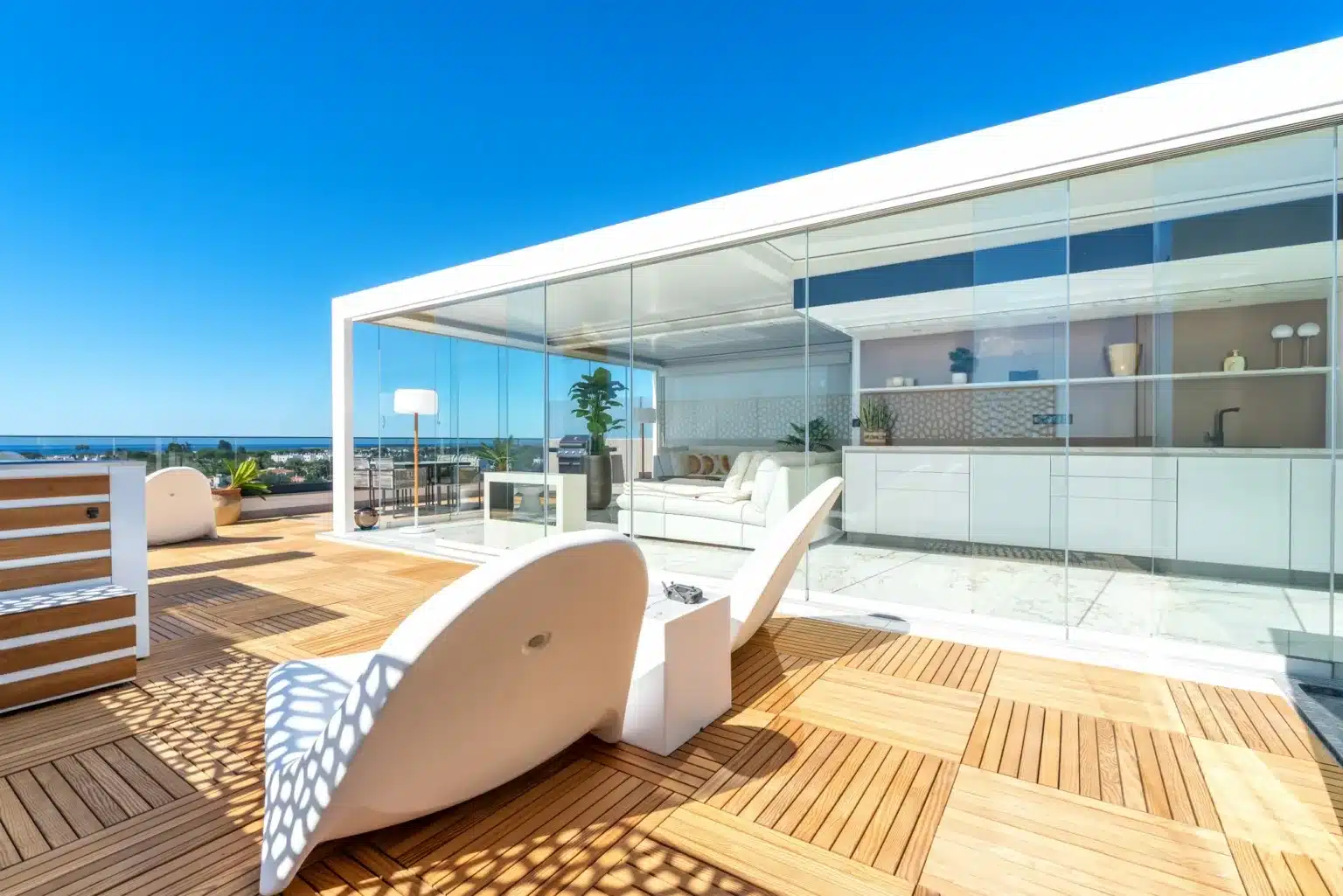 White Solembra pergola with glass walls on a sea-view terrace